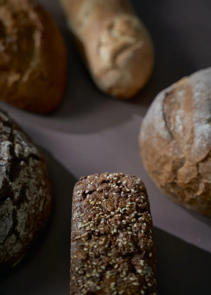 Rustic artisan bread loaves Rustic artisan bread loaves with flour-dusted crusts and seeds.
